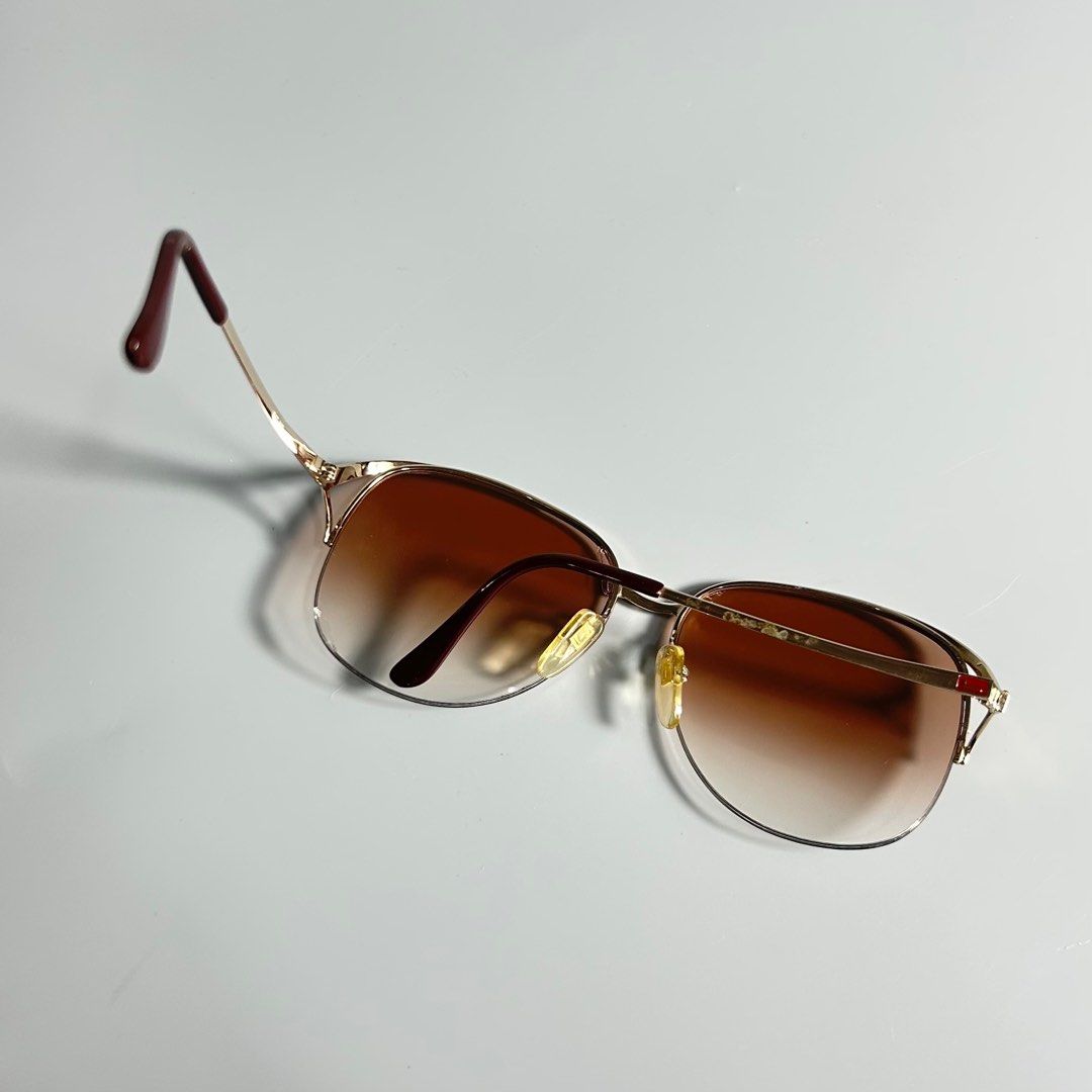 80s Vintage Lancel Paris Sunglasses (Category: Luxury Accessories) located in Cavite. Submitted by datsoretro (Listing ID 1410359329, Image 1). Description: - Lancel Paris sunglasses - Gold frame - Brown gradient lenses - Unique design with red accent - Replaceable lenses are a bit cracked -check last photo.