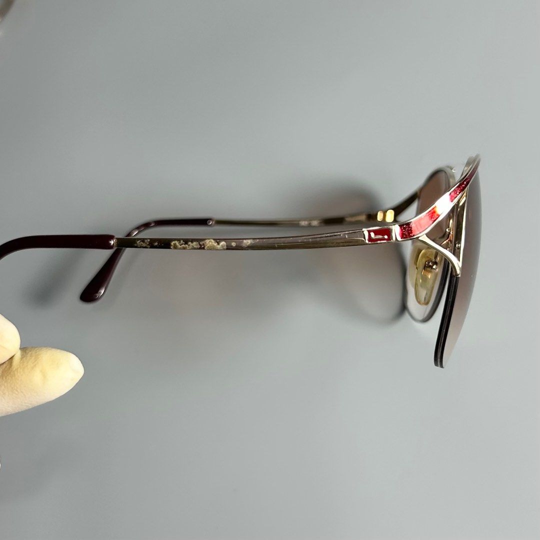 80s Vintage Lancel Paris Sunglasses (Category: Luxury Accessories) located in Cavite. Submitted by datsoretro (Listing ID 1410359329, Image 3). Description: - Lancel Paris sunglasses - Gold frame - Brown gradient lenses - Unique design with red accent - Replaceable lenses are a bit cracked -check last photo.