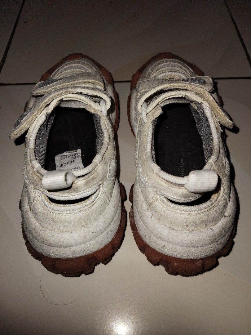 Acne Studios White Sneakers (Category: Sneakers) located in Batangas. Submitted by kasualcornerph (Listing ID 1410274097, Image 2). Description: - Acne Studios sneakers - Size 38 - Orange soles - Two velcro straps - Made in China Reason for selling need funds for emergency feel free to message me for more information..
