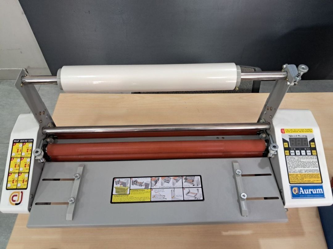 Aurum Laminator Machine A2 (Category: Office & Business Technology) located in Quezon City. Submitted by copieronlineinc (Listing ID 1410198294, Image 1). Description: - Digital display and adjustable settings - Includes laminating film - Sturdy metal frame construction - Gray base - Designed for professional or frequent use - Clear control panel with instructions.