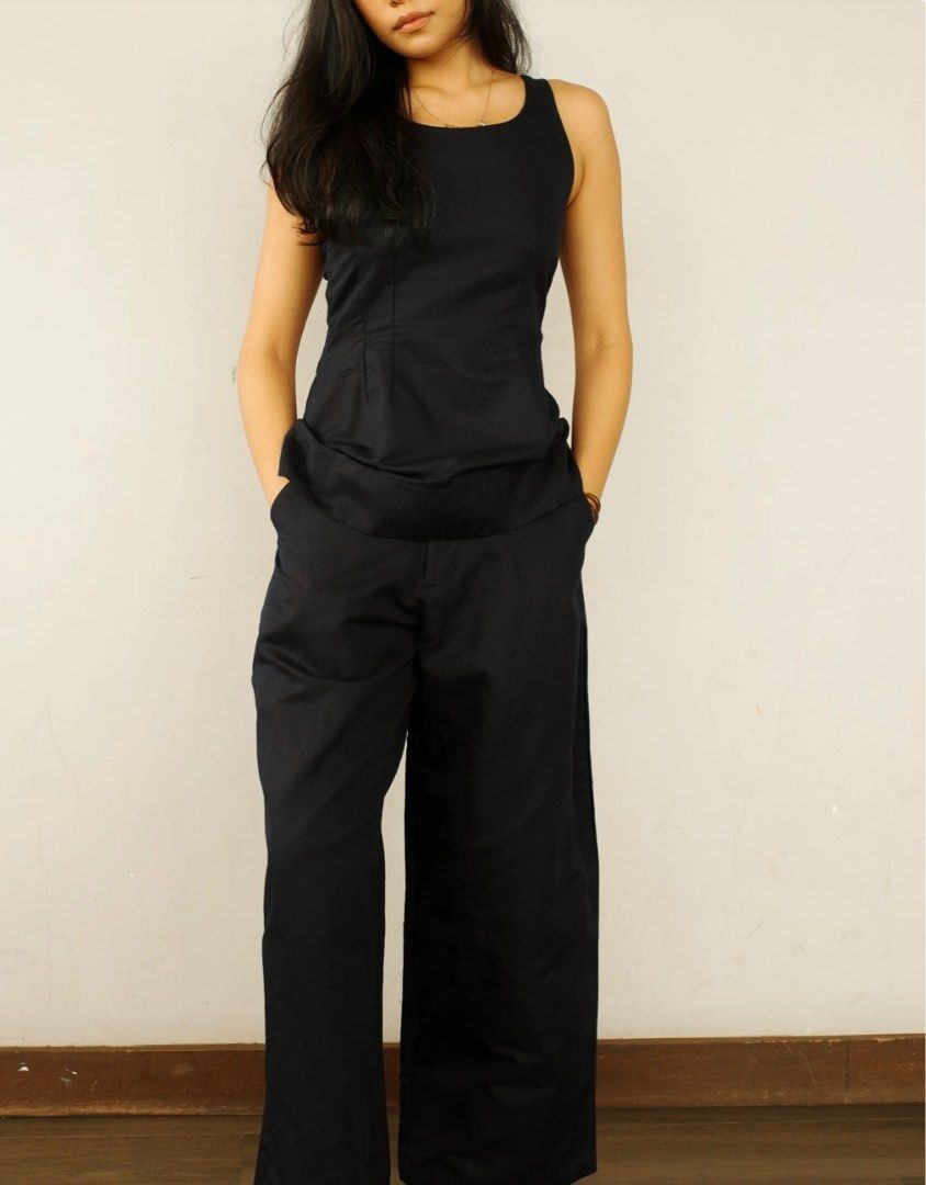 AVA The Brand Martina Set - Navy (Category: Dresses) located in San Pedro. Submitted by emcto (Listing ID 1410223124, Image 2). Description: Stylish Martina set from AVA The Brand. This set includes a sleeveless top and wide-leg pants in navy. The top features a fitted bodice and a slightly flared hem. The pants have a comfortable, relaxed fit. Perfect for a chic and effortless look. The set is made of a solid, likely woven fabric..