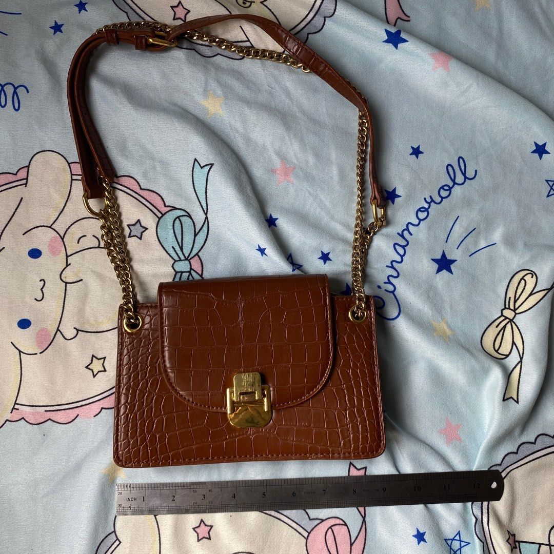 Brown Crocodile-Embossed Chain Bag Shoulder Messenger (Category: Cross-body Bags) located in Taguig. Submitted by anndefined (Listing ID 1410194486, Image 1). Description: - has flaws, pls refer to photos - free when you buy an item from me.