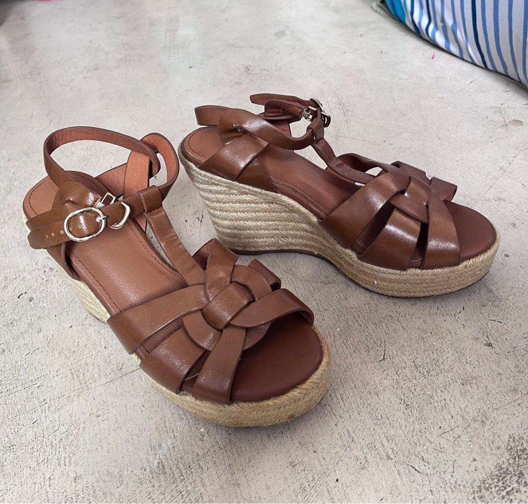 Brown Wedge Sandals (Category: Flats & Sandals) located in Bulacan. Submitted by handlewithcaution (Listing ID 1410309590, Image 2). Description: Brown Wedge Sandals Size 35/ 22cm Preloved, may minimal flaw not noticeable. No brand but the quality 10/10. Video call accepted but for sure buyer only. Location: Tanza Cavite.