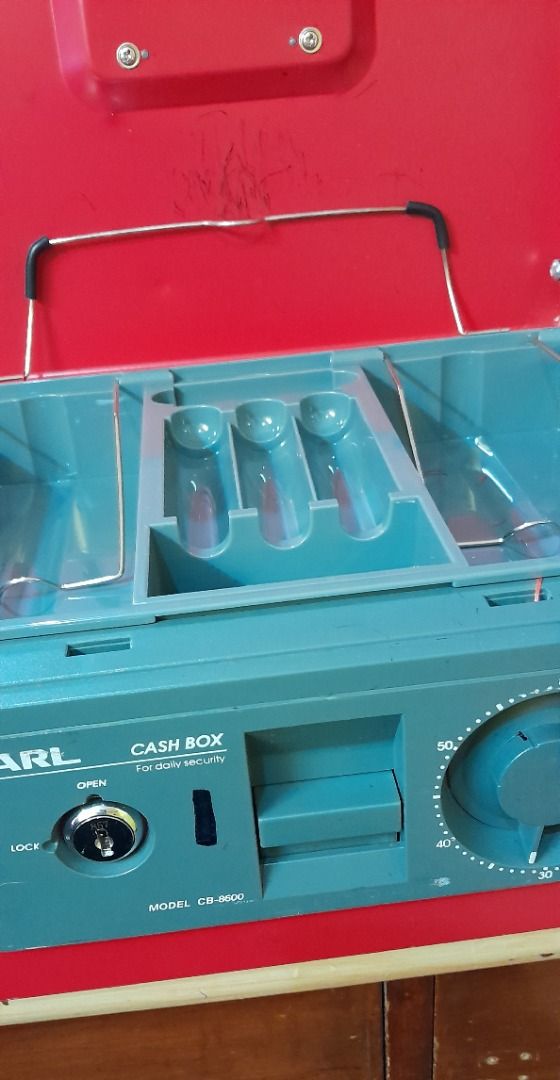 Carl Cash Box with Combination Lock (Category: Safe) located in Caloocan City. Submitted by mina_mahal (Listing ID 1409960984, Image 3). Description: - Red Carl cash box - Combination lock and key lock - Convenient carrying handle - Number "2" on the side - Good working condition.