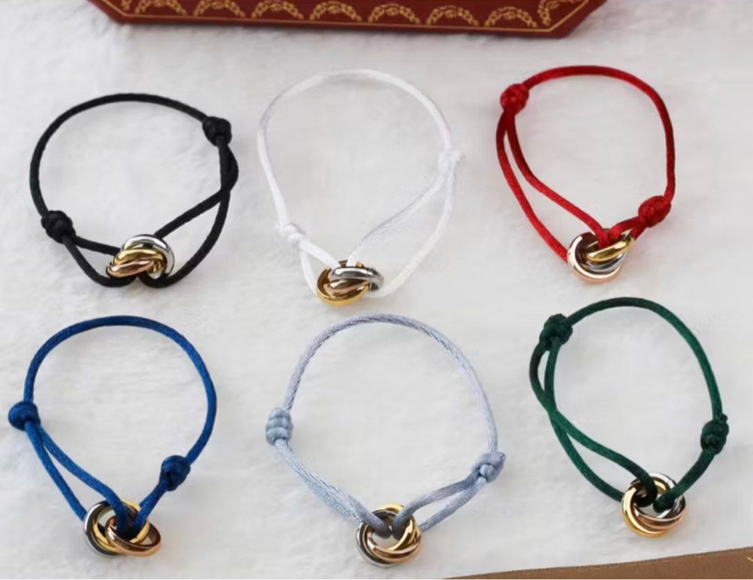 Cartier Trinity Bracelet with Cord Premium Copy (Category: Bracelets) located in Batangas. Submitted by stelaboutique (Listing ID 1410297447, Image 1). Description: - Trinity design bracelet - Premium Copy - Features three interlocking rings - Adjustable cord - Available cord colors: Black, White, Red, Blue, Gray, Green - Perfect for everyday wear.