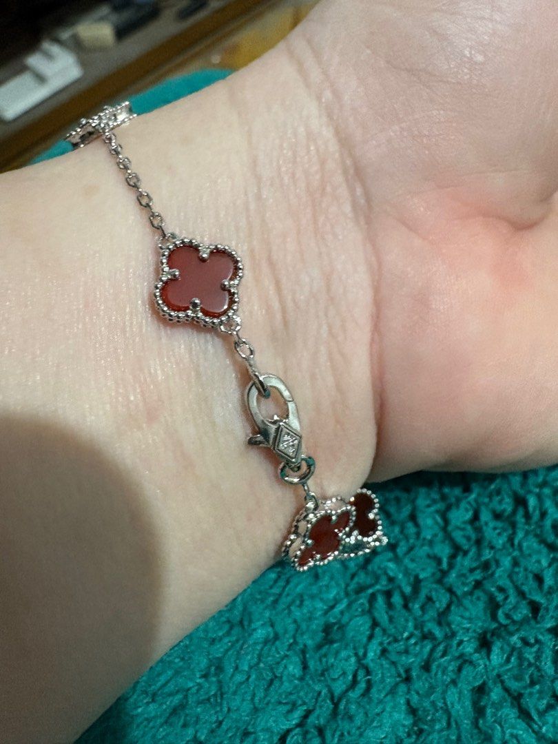 Pre-order Clover Bracelet with Red Accents (Category: Bracelets) located in Cavite. Submitted by ladyrain21 (Listing ID 1410339587, Image 3). Description: Silver Titanium with red semi precious stone 9mm clover 7.5inches length With markings on lock.