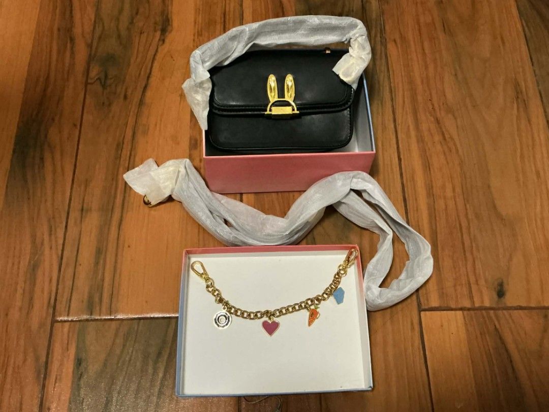 Disney Charles & Keith Bunny Bag (Category: Shoulder Bags) located in Alaminos. Submitted by declutteritems2024 (Listing ID 1410313841, Image 3). Description: rfs: decluttering SF is shouldered by the buyer origin: Alaminos, Pangasinan Delivery thru J&T Luzon: php 59.00 - Disney x Charles & Keith black handbag - Bunny ear clasp - Detachable chain with charms - Includes original box and dust bag - Interior zipper pocket - Used once .