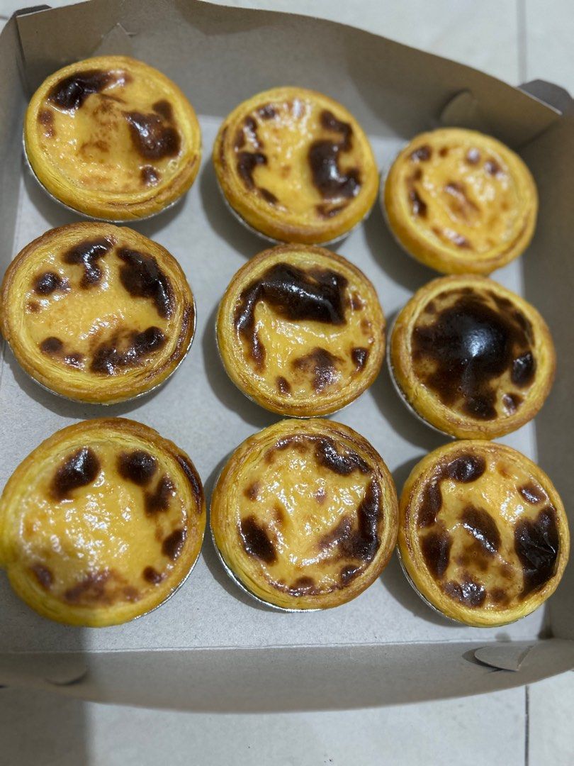 Egg Tarts - Box of 12 (Category: Homemade Bakes) located in Valenzuela. Submitted by roseannann (Listing ID 1410288818, Image 2). Description: 12 pcs ₱385 Delicious, freshly baked egg tarts, perfect for a sweet treat! Each box contains nine tarts with a flaky crust and a creamy, custard filling. The tarts have a beautiful, slightly caramelized top. Ideal for sharing or enjoying all by yourself. Ready to eat and enjoy!.