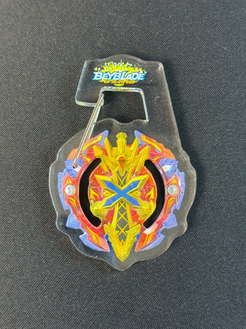 FuRyu Beyblade Carabiner/Keychain (Category: Character Goods) located in Quezon City. Submitted by markdspark16 (Listing ID 1410200549, Image 3). Description: - FuRyu brand - Beyblade keychains for your keys or bags! - Features various Beyblade designs. - Clear acrylic backing. - Attached to a metal clip..