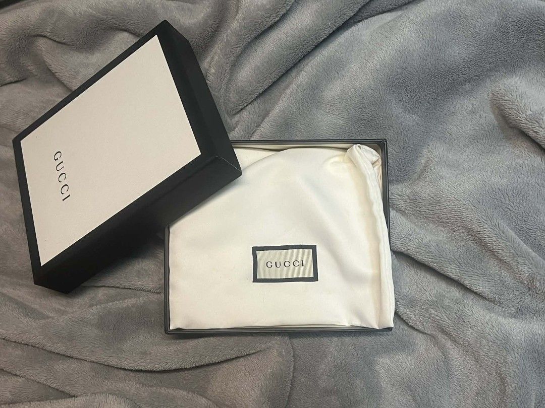 Gucci Card Case Wallet (Category: Luxury Bags & Wallets) located in Bacolor. Submitted by dizonjm21164367 (Listing ID 1410360616, Image 2). Description: - Authentic Gucci card case wallet - Black textured leather - Gold-tone GG logo - Zip closure - Multiple card slots - Interior zip pocket - Includes original box and dust bag.