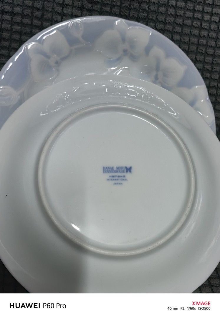 Hanae Mori Dinnerware Plates (Category: Dinnerware & Cutlery) located in Rizal. Submitted by gkstcenit (Listing ID 1410249844, Image 2). Description: - Set of two Hanae Mori dinner plates - Features a delicate floral design - Subtle blue hue - Marked with Hanae Mori logo and "Japan" - Approximately 15cm in diameter.
