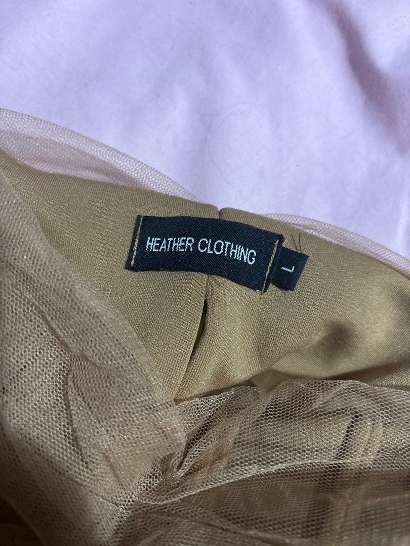 Heather Clothing Corset Top - Size L (Category: Sleeveless) located in Cainta. Submitted by kondomari (Listing ID 1410285279, Image 3). Description: - Heather Clothing dress - Size: L - Unique mesh overlay design - Fitted bodice - Flowing skirt - Neutral color - Versatile for different occasions - Back zipper closure.