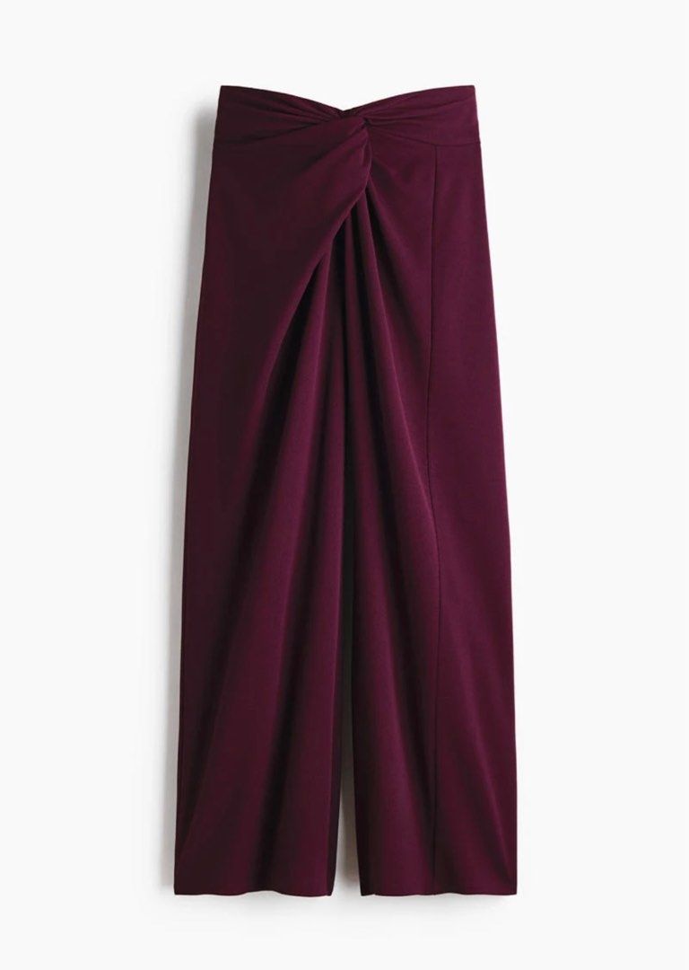 H&M Twisted-detail trousers (Category: Other Bottoms) located in Paranaque City. Submitted by vestured.ph (Listing ID 1410344814, Image 2). Description: Used once !!! :) - Fits M-L - Burgundy wide-leg pants - Unique knot detail at front waist - High-waisted - Relaxed, flowing fit - Smooth, woven fabric - Creates a chic and sophisticated look.