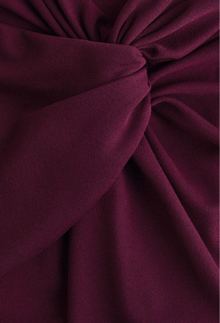 H&M Twisted-detail trousers (Category: Other Bottoms) located in Paranaque City. Submitted by vestured.ph (Listing ID 1410344814, Image 3). Description: Used once !!! :) - Fits M-L - Burgundy wide-leg pants - Unique knot detail at front waist - High-waisted - Relaxed, flowing fit - Smooth, woven fabric - Creates a chic and sophisticated look.