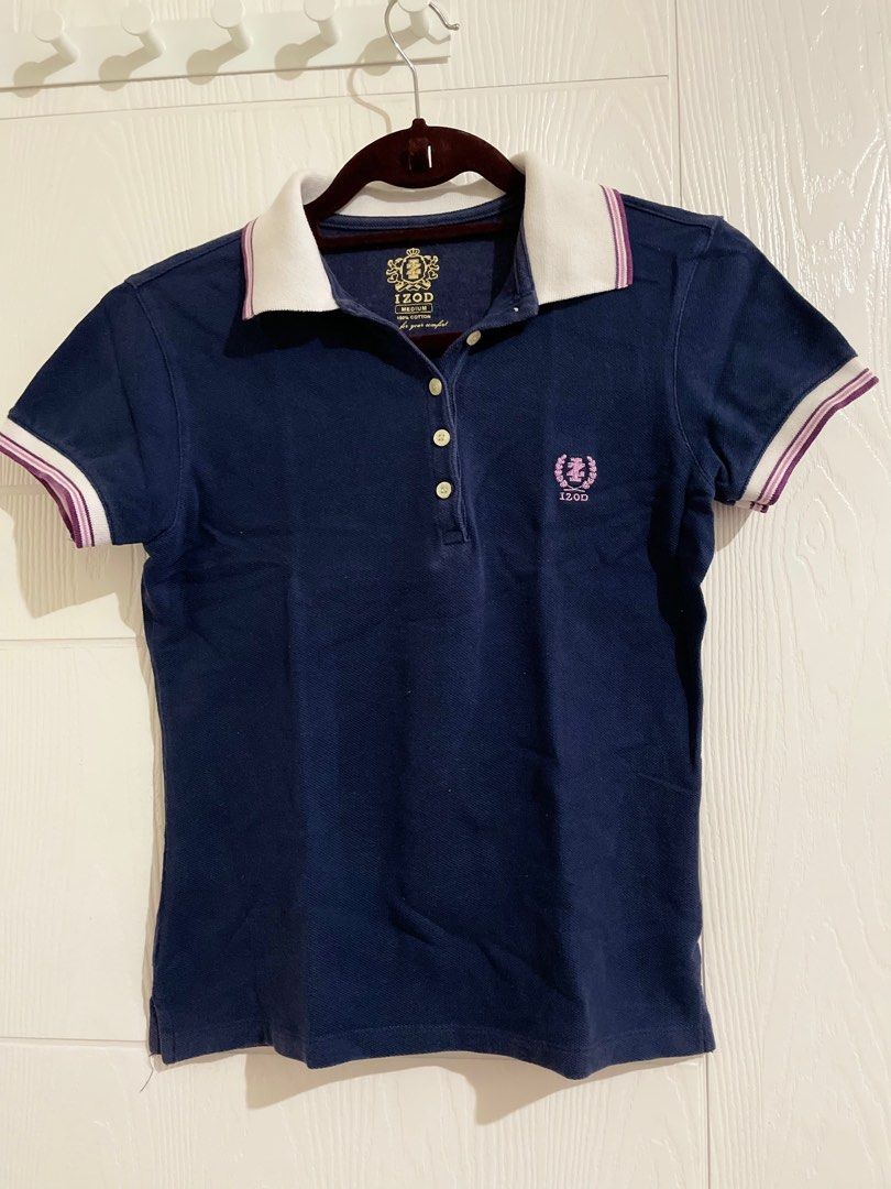 IZOD Navy Blue Polo Shirt (Category: Shirts) located in Pasig City. Submitted by luisaadv (Listing ID 1410235668, Image 1). Description: - Navy blue IZOD polo shirt - White collar and sleeve trim - IZOD logo on chest - Three-button neckline - Short sleeves.