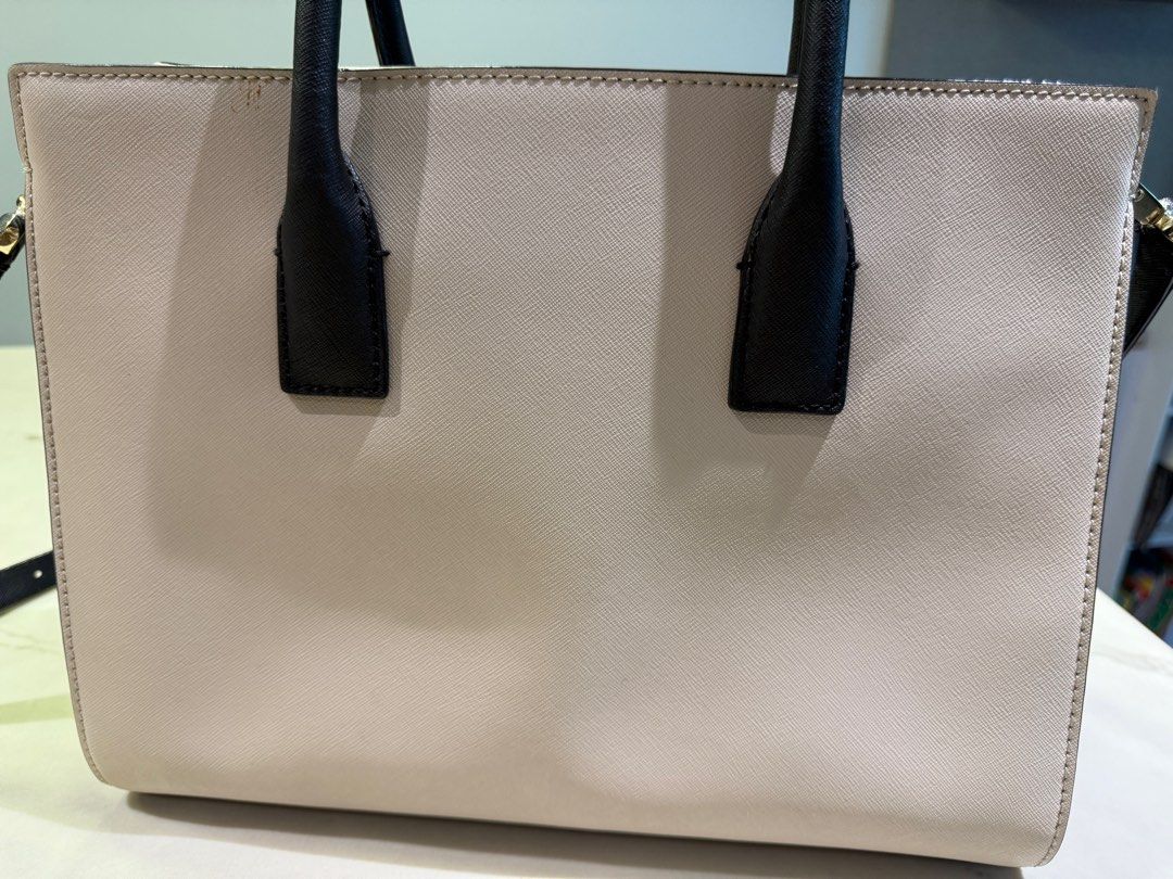Kate Spade Cameron Street Candace Satchel (Category: Luxury Bags & Wallets) located in Mandaluyong City. Submitted by helolu (Listing ID 1410186328, Image 3). Description: - Kate Spade Candace Satchel - purchased from Canada - Color: Cream and Black - Features: - Top handle - Detachable shoulder strap - Gold-tone zipper and hardware - Interior: Striped lining with multiple compartments - Includes: Care card and tags .