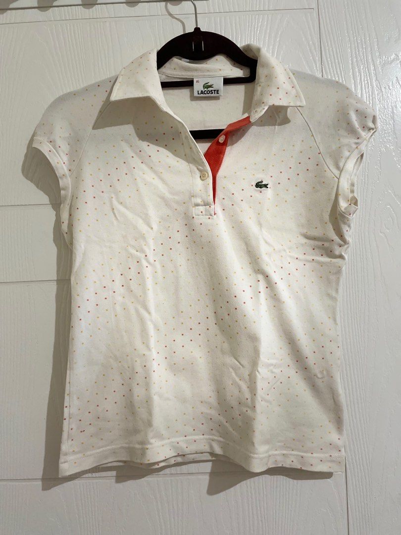 Lacoste Polka Dot Polo Shirt (Category: Shirts) located in Pasig City. Submitted by luisaadv (Listing ID 1410236106, Image 1). Description: - Lacoste polo shirt - Polka dot pattern - Classic collar - Short sleeves - Small Lacoste logo - Orange collar detail - Button-up placket - Regular fit.