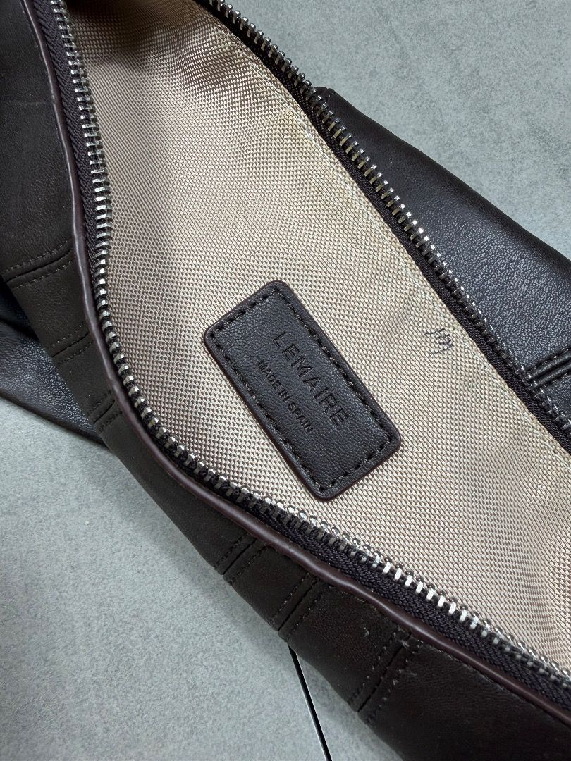 Lemaire Croissant Bag (Category: Luxury Bags & Wallets) located in Subic. Submitted by concretefloor (Listing ID 1410238123, Image 3). Description: Lemaire - Croissant Bag Made in Spain Very good condition Has leather crack on puller No major flaw 9/10 condition.