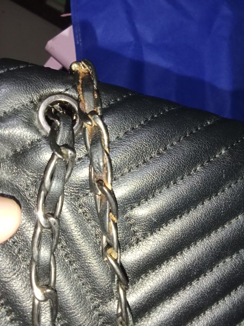 Louis Quatorze Convertible Sling (LQ) (Category: Luxury Bags & Wallets) located in Meycauayan. Submitted by nettystrendyshopph (Listing ID 1404247994, Image 3). Description: - Black quilted design - Flap closure with logo detail - Stylish chain strap (gun metal) -Excellent Condition -Small to Medium size -May rust sa chain and minimal rubs sa body 4x8 inches.