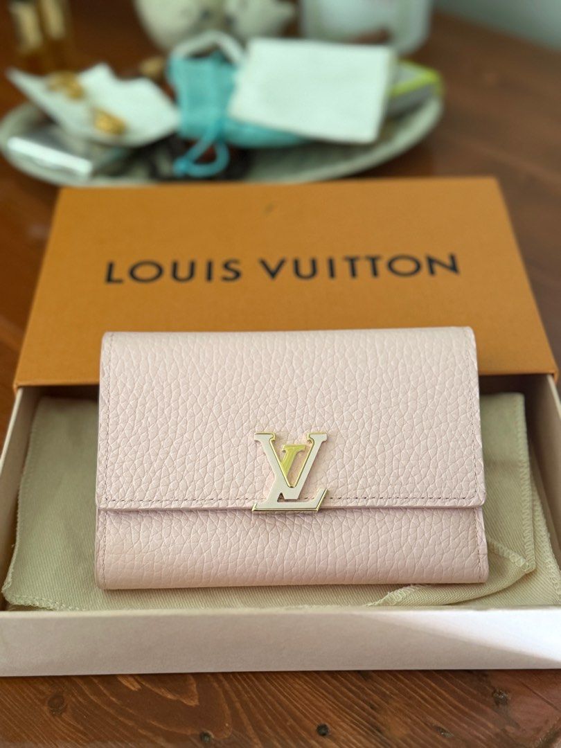 Louis Vuitton Capucines Compact Wallet (Category: Luxury Bags & Wallets) located in San Pablo. Submitted by _studioelaine (Listing ID 1410325741, Image 1). Description: LV Capuccine Compact Wallet Microchipped Color: Pink Jasmine Inclusions: Box Dustbag.