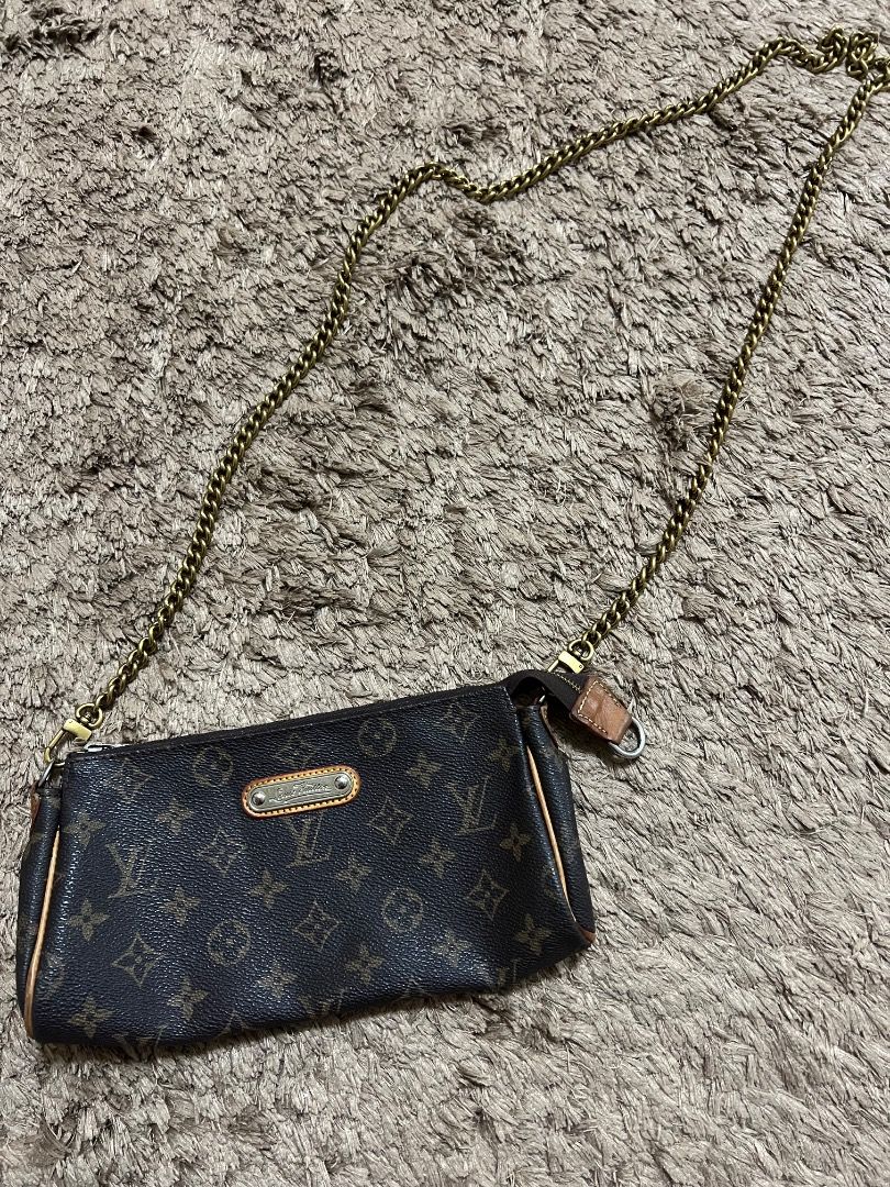 LOUIS VUITTON Monogram Crossbody Bag (Category: Luxury Bags & Wallets) located in Manila. Submitted by cluttercrushers (Listing ID 1410197738, Image 2). Description: Louis Vuitton Monogram Eva Pochette Up for sale is a well-loved Louis Vuitton Monogram Eva Crossbody Pochette. • stylish and versatile bag features the iconic monogram pattern. Please note that the chain is a non-original replacement that I purchased online. Condition : Used, with ty