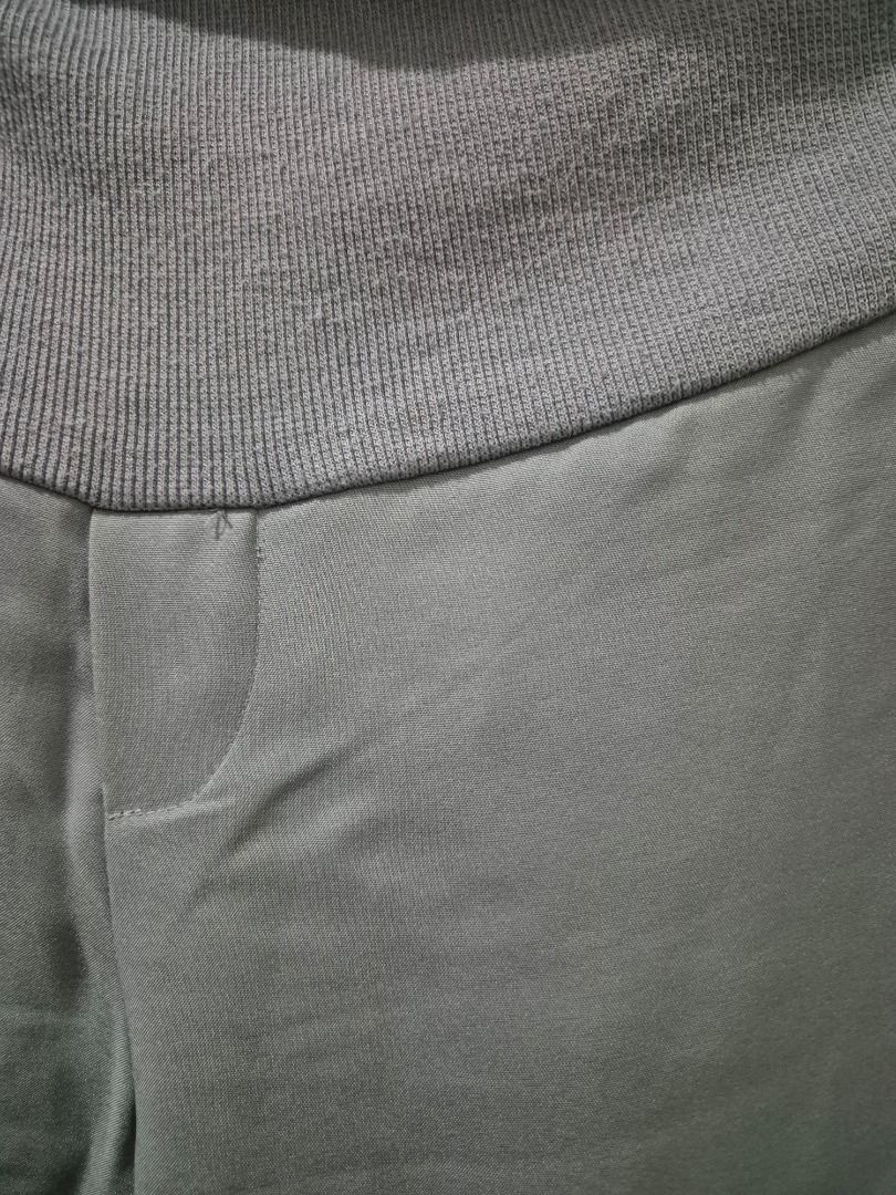 Maternity Pants (Category: Maternity wear) located in Kuala Lumpur. Submitted by normizs (Listing ID 1410334398, Image 2). Description: Comfortable maternity pants in light grey. Features a knit waistband, smooth fabric, straight leg, and pockets. Stylish and comfy for expecting mothers!.