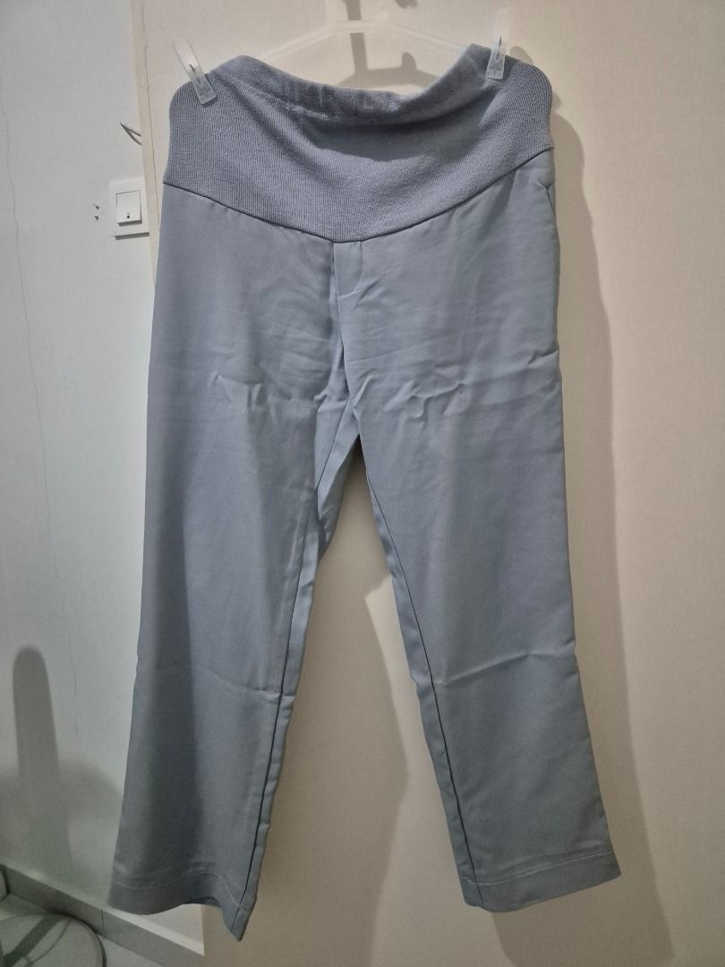 Maternity Pants (Category: Maternity wear) located in Kuala Lumpur. Submitted by normizs (Listing ID 1410334398, Image 1). Description: Comfortable maternity pants in light grey. Features a knit waistband, smooth fabric, straight leg, and pockets. Stylish and comfy for expecting mothers!.