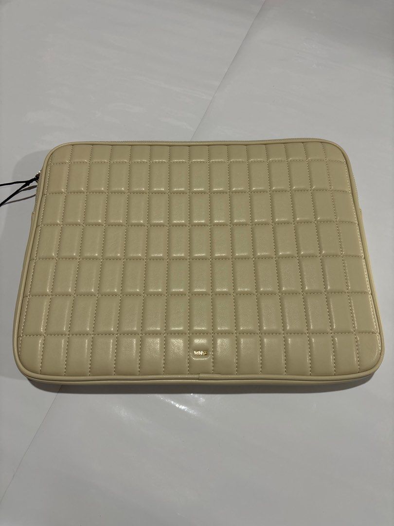 Mesa Quilted Laptop Sleeve (Category: Laptop Bags & Sleeves) located in Taguig. Submitted by passionfashion (Listing ID 1410291343, Image 1). Description: Cream-colored laptop sleeve with a quilted design. Features a gold-toned zipper and a small Mesa logo. The interior is a light beige color. Measures approximately 15 inches by 11 inches. Includes a small pocket inside..