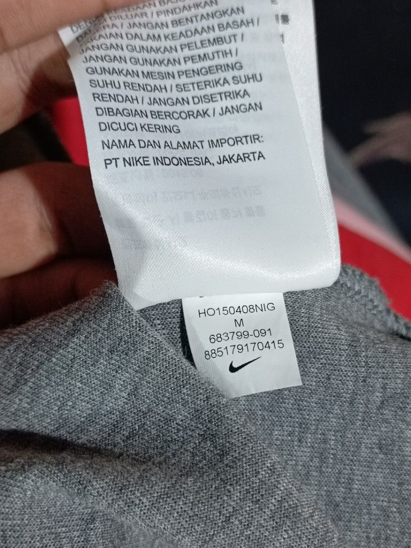 Nike Tech Fleece Hoodie - Gray - Size M (Category: Activewear) located in Manila. Submitted by warm_oddturtle.169897 (Listing ID 1410201811, Image 3). Description: Nike Tech Fleece hoodie in gray. Features a high neck design and a small Nike logo on the chest. The size is M. Made in China. The hoodie has a unique design with pockets and a comfortable fit. Perfect for casual wear or workouts. medium for women dimes 18x22.
