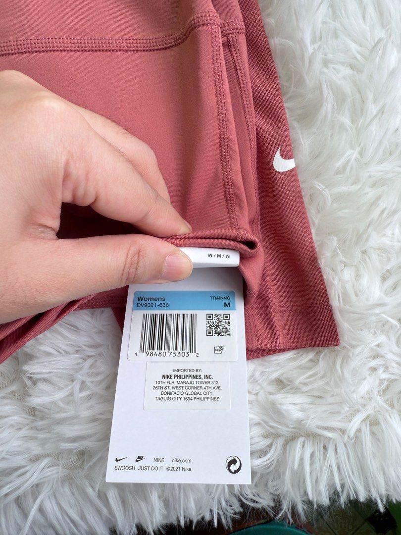Nike Training Leggings - Dusty Rose - Size M (Category: Activewear) located in Manila. Submitted by luigeedeo (Listing ID 1410337971, Image 3). Description: - Nike training leggings - Dusty rose color - Size M - Nike swoosh logo - Mesh panel detail - Style code: DV9021-638 - Made in the Philippines.