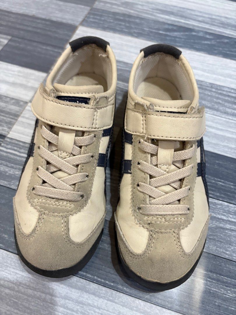 Onitsuka Tiger Kids Shoes (Category: Babies & Kids Fashion) located in Quezon City. Submitted by Hearty (Listing ID 1410185667, Image 3). Description: - Onitsuka Tiger kids' shoes - Beige and navy color scheme - Hook-and-loop strap closure - Brand name on heel - Suede toe cap - Iconic tiger stripes on the side - seldom used - size uk11 17.5cm.