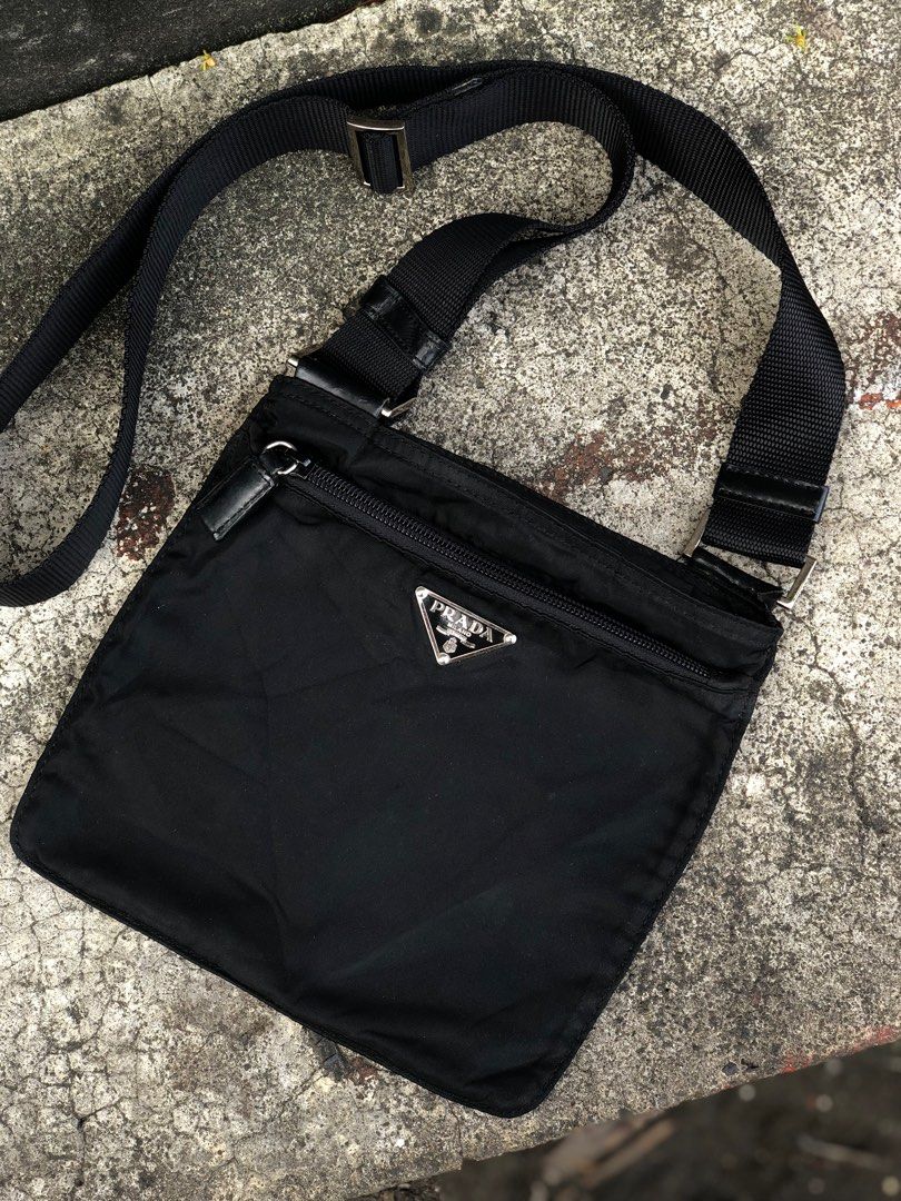 Prada Black Nylon Crossbody Bag (Category: Luxury Bags & Wallets) located in Bacolod City. Submitted by money_maker06 (Listing ID 1410216989, Image 2). Description: Prada Sling Bag 🌳 •Rare Size •Vintage •Authentic/Legit ✅ •Condition: Used/Good •Issue: Cracks,Peel off on leather and Just a normal sign of used 🖊 •Need restoration 🪵 •Price: 6999 💰 •Click each picture to appreciate the item 📸 •Dm me if you’re interested. I can give you more deta