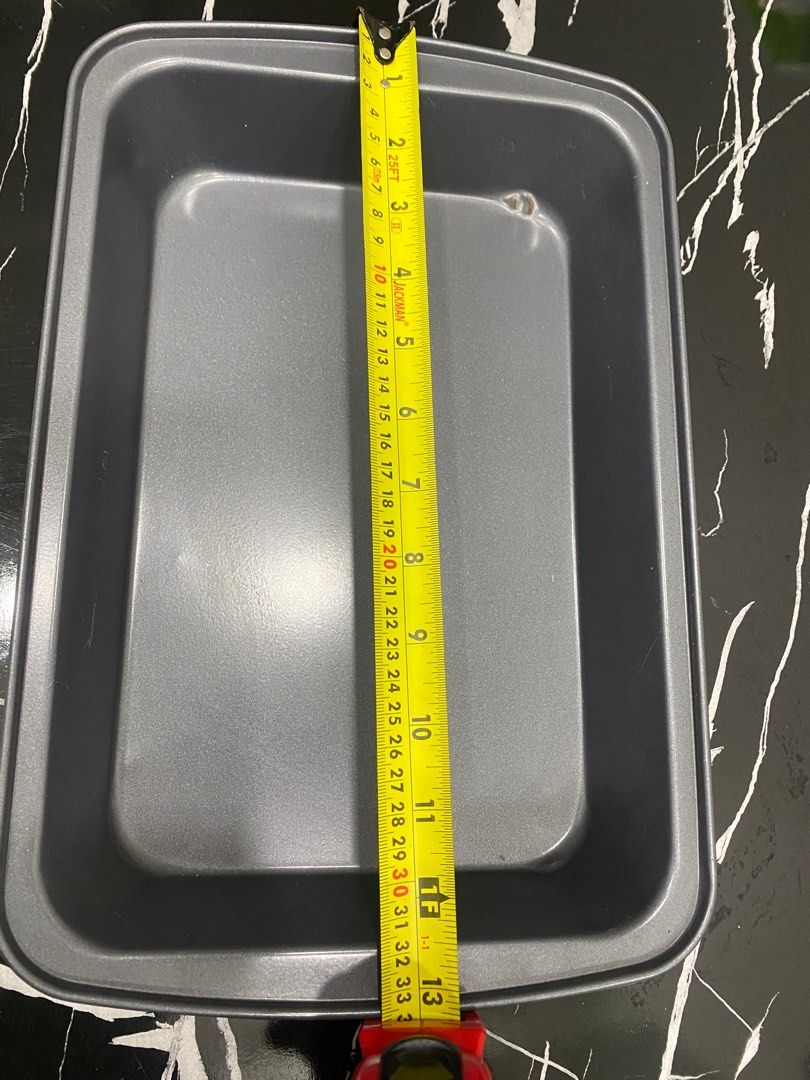 Rectangular Baking Pan - Used (Category: Bakeware) located in Singapore. Submitted by bryen292 (Listing ID 1410292446, Image 1). Description: Used rectangular baking pan. Dimensions are approximately 13 inches long and 9 inches wide. There is some minor wear and tear, as shown in the photos. Perfect for baking cakes, brownies, or casseroles. Great for home bakers! Selling coz my new oven is small. Self collection from Toa Payoh MRT. .