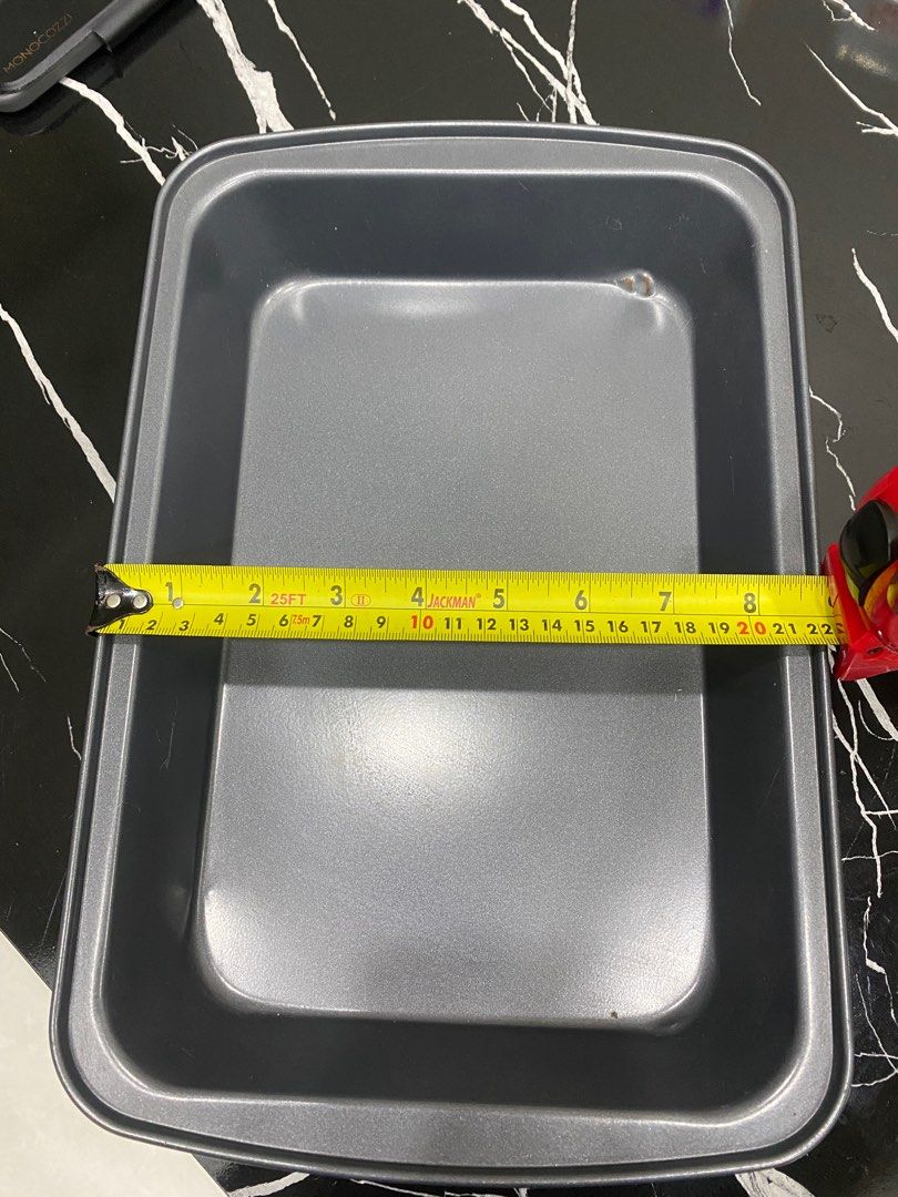 Rectangular Baking Pan - Used (Category: Bakeware) located in Singapore. Submitted by bryen292 (Listing ID 1410292446, Image 2). Description: Used rectangular baking pan. Dimensions are approximately 13 inches long and 9 inches wide. There is some minor wear and tear, as shown in the photos. Perfect for baking cakes, brownies, or casseroles. Great for home bakers! Selling coz my new oven is small. Self collection from Toa Payoh MRT. .