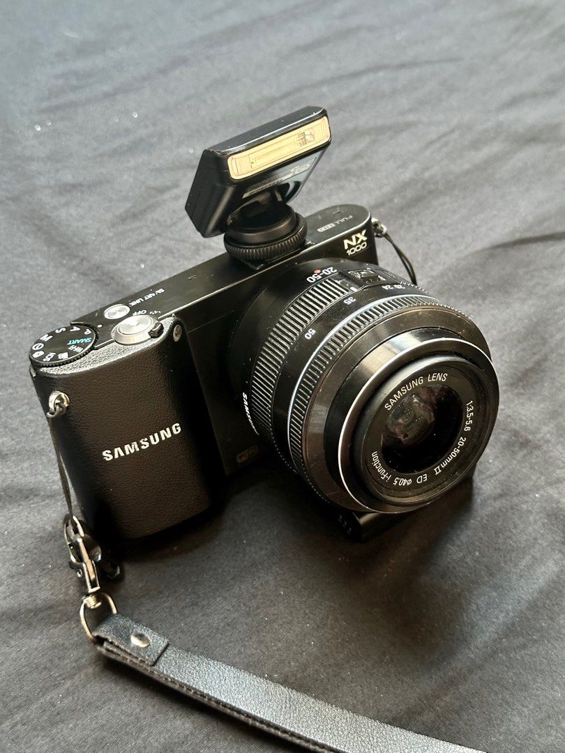 Samsung NX 1000 (Category: Cameras) located in Quezon. Submitted by rinatsky (Listing ID 1410191988, Image 2). Description: SAMSUNG NX 1000 PHP 10,499 - 20.3 mega pixels - Wifi and NFC + 1080p HD movie recording - best features: retro effect, soft focus, vivid, portrait, clasic effect, and custom rgb effect - more features: old film effect, half tone, night mode, sunset mode, beach mode, forest, & many more vintage outputs - white balance is also