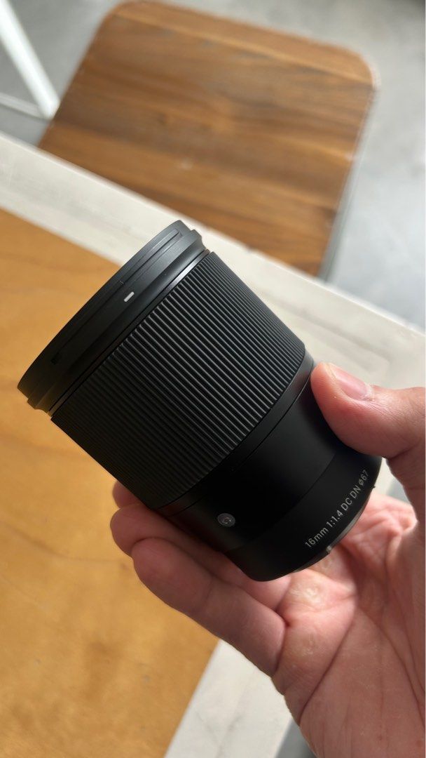 Sigma 16mm f/1.4 DC DN Lens E-Mount Sony APSC (Category: Lens & Kits) located in Manila. Submitted by tsukkisell (Listing ID 1410297828, Image 2). Description: Details: * Sigma 16mm f/1.4 DC DN Contemporary * For APS-C mirrorless cameras (Sony E-mount) * Includes front and rear caps + lens hood * Comes with original box * Glass and body in excellent condition * Smooth focus ring, clean contacts Condition: * In great condition, like mint condition