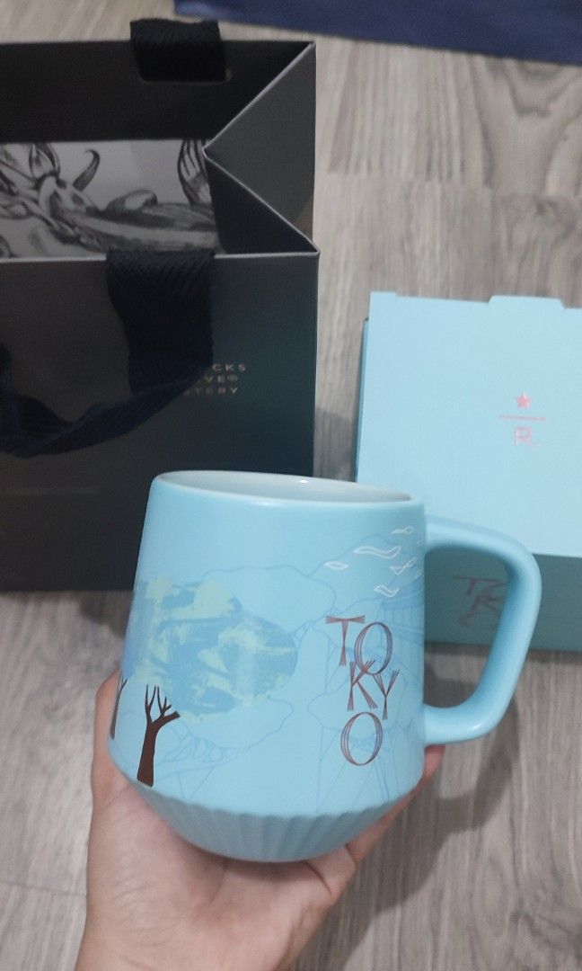 Starbucks Tokyo Mug (Category: Coffee & Tea Tableware) located in Quezon City. Submitted by knshop12 (Listing ID 1410251650, Image 3). Description: Starbucks Reserve Roastery Tokyo Mug - Brand new - Color: Blue - Includes original box and paper bag - Unique design with handle.