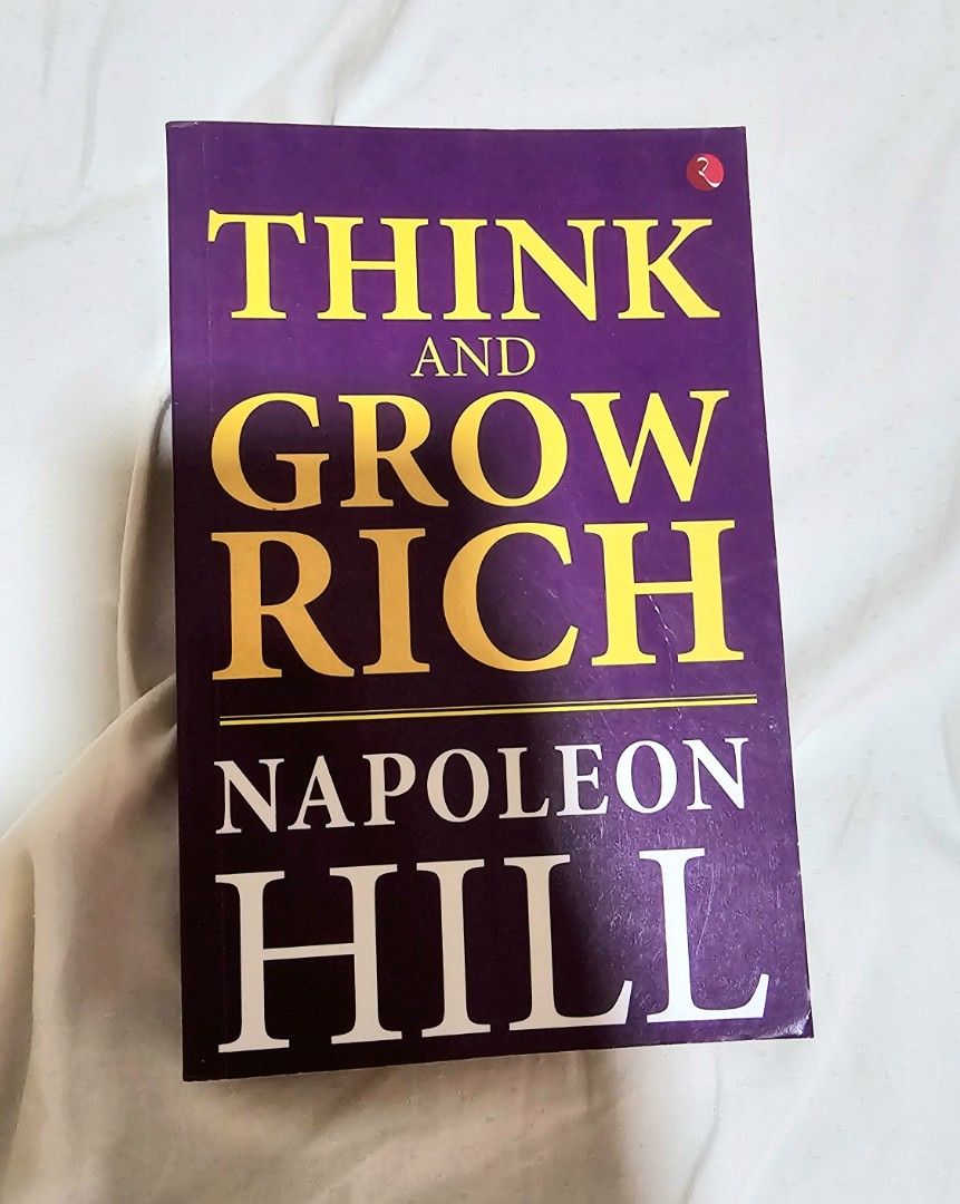 Think and Grow Rich by Napoleon Hill (Category: Storybooks) located in Rosario. Submitted by prelovedbyengineertoni (Listing ID 1410194499, Image 1). Description: - Think and Grow Rich by Napoleon Hill - Purple cover with yellow and white text - Focuses on personal development and financial success - A must-read self-help classic.