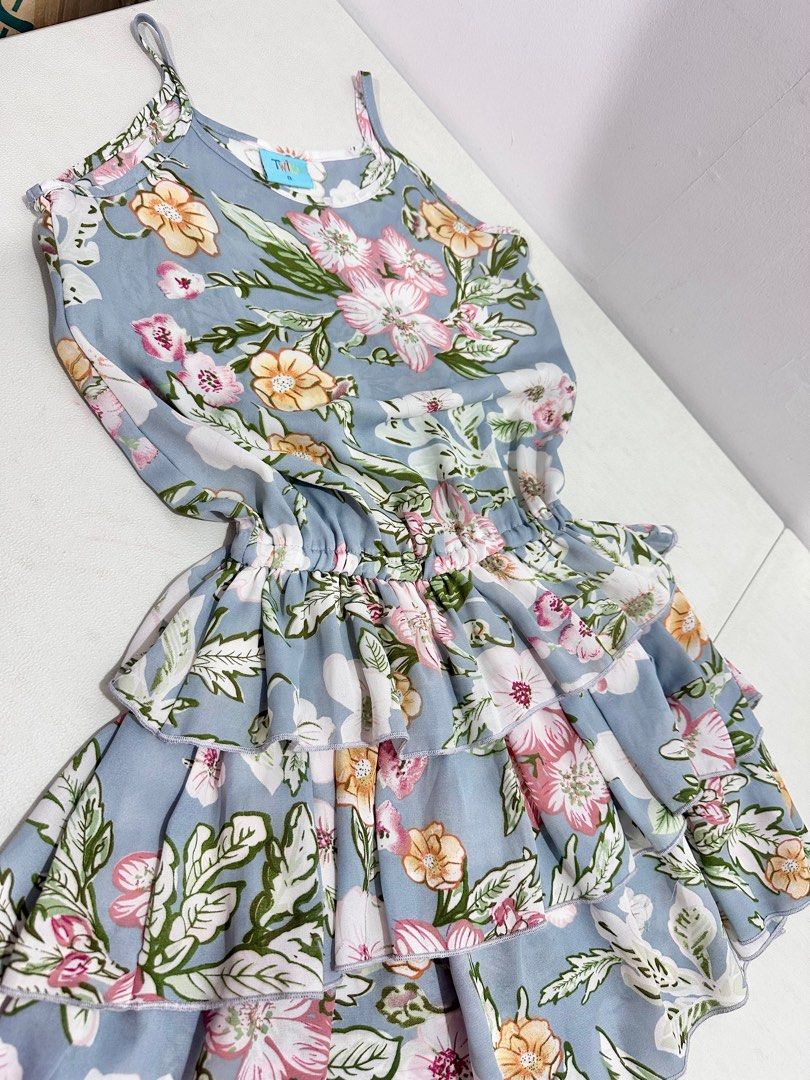 Twilo Summer Floral Ruffle Dress (Category: Babies & Kids Fashion) located in Quezon City. Submitted by cranehead (Listing ID 1410243240, Image 2). Description: - Floral print dress - Colors: Blue, pink, and yellow - Design: Tiered ruffles, spaghetti straps - Features: Elastic waist - Brand: Twilo - Size: 8 - Perfect for casual or summer events -Size bust 14.5 inches Waist 10 to 13 Length 30 inches.