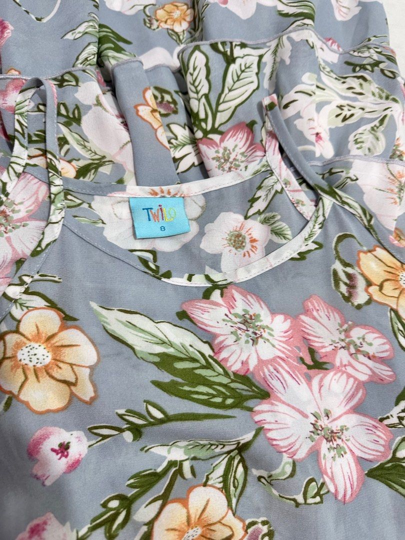 Twilo Summer Floral Ruffle Dress (Category: Babies & Kids Fashion) located in Quezon City. Submitted by cranehead (Listing ID 1410243240, Image 3). Description: - Floral print dress - Colors: Blue, pink, and yellow - Design: Tiered ruffles, spaghetti straps - Features: Elastic waist - Brand: Twilo - Size: 8 - Perfect for casual or summer events -Size bust 14.5 inches Waist 10 to 13 Length 30 inches.