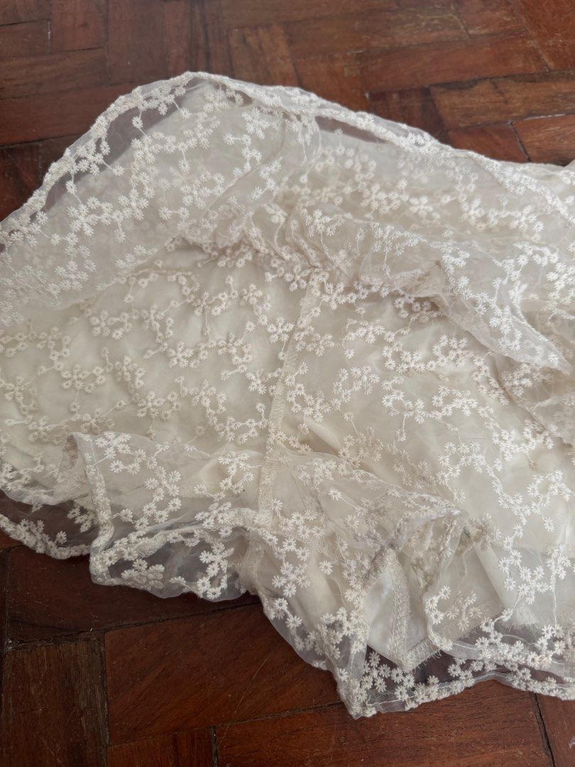Vintage Cream Lace Skort (Category: Skirts) located in Manila. Submitted by riversen (Listing ID 1410265292, Image 2). Description: - Delicate lace overlay - Floral pattern - Layered design - Ruffled hem - Light cream color - Comfortable fit - Versatile for various occasions.