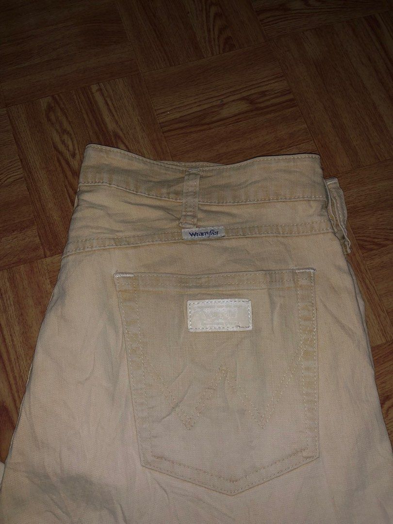 Vintage wrangler pants (Category: Jeans) located in Manila. Submitted by cristianm._hawk (Listing ID 1410292610, Image 2). Description: Vintage wrangler pants Color: khaki off white Color rate: 9/10 Size: 35 on tag Issue: very minimal stain not visible Dimes: W: 17'half L:40 Leg opening: 9'half Vintage / late 90s – early 2000s era White tab + classic “W” back pocket stitch Clean khaki / off-white color Natural fade only, no major flaws Straight t
