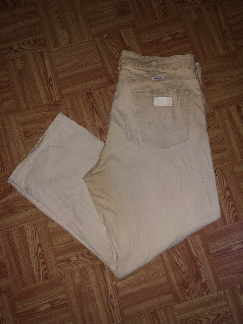 Vintage wrangler pants (Category: Jeans) located in Manila. Submitted by cristianm._hawk (Listing ID 1410292610, Image 1). Description: Vintage wrangler pants Color: khaki off white Color rate: 9/10 Size: 35 on tag Issue: very minimal stain not visible Dimes: W: 17'half L:40 Leg opening: 9'half Vintage / late 90s – early 2000s era White tab + classic “W” back pocket stitch Clean khaki / off-white color Natural fade only, no major flaws Straight t
