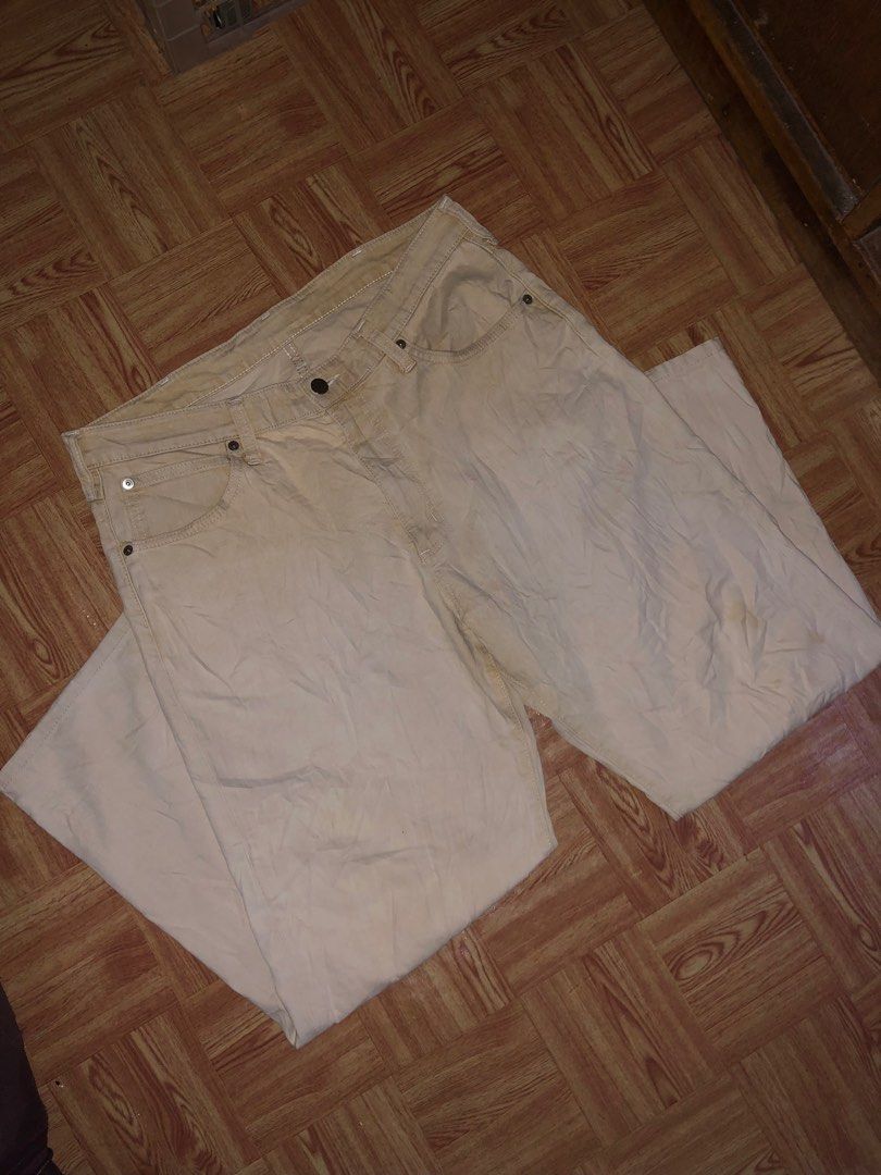 Vintage wrangler pants (Category: Jeans) located in Manila. Submitted by cristianm._hawk (Listing ID 1410292610, Image 3). Description: Vintage wrangler pants Color: khaki off white Color rate: 9/10 Size: 35 on tag Issue: very minimal stain not visible Dimes: W: 17'half L:40 Leg opening: 9'half Vintage / late 90s – early 2000s era White tab + classic “W” back pocket stitch Clean khaki / off-white color Natural fade only, no major flaws Straight t