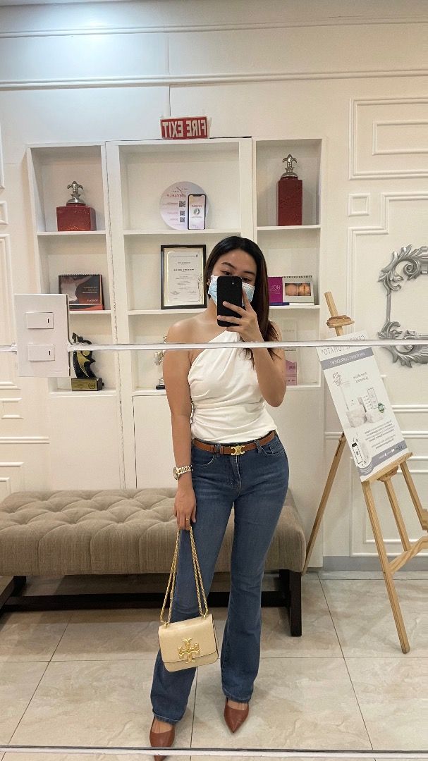 White One-Shoulder Top (Category: Sleeveless) located in Pasig City. Submitted by alwaysfaevored (Listing ID 1410353725, Image 1). Description: - Elegant white one-shoulder top - Features a stylish draped design - Versatile for various occasions - Easy to pair with jeans or trousers - A chic addition to your wardrobe.