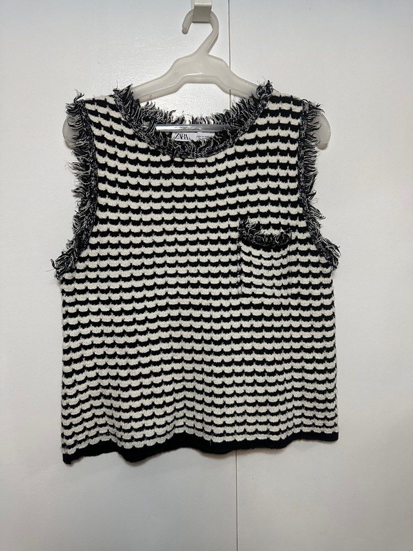 Zara Sleeveless Top with Buttons (Category: Sleeveless) located in Taguig. Submitted by rlg.declutterph (Listing ID 1410259310, Image 1). Description: - Zara sleeveless top - Size: M - Pattern: Black and white - Details: Fringe, decorative buttons, small pocket -textured di ko alam tawag sa tela hehehehe .