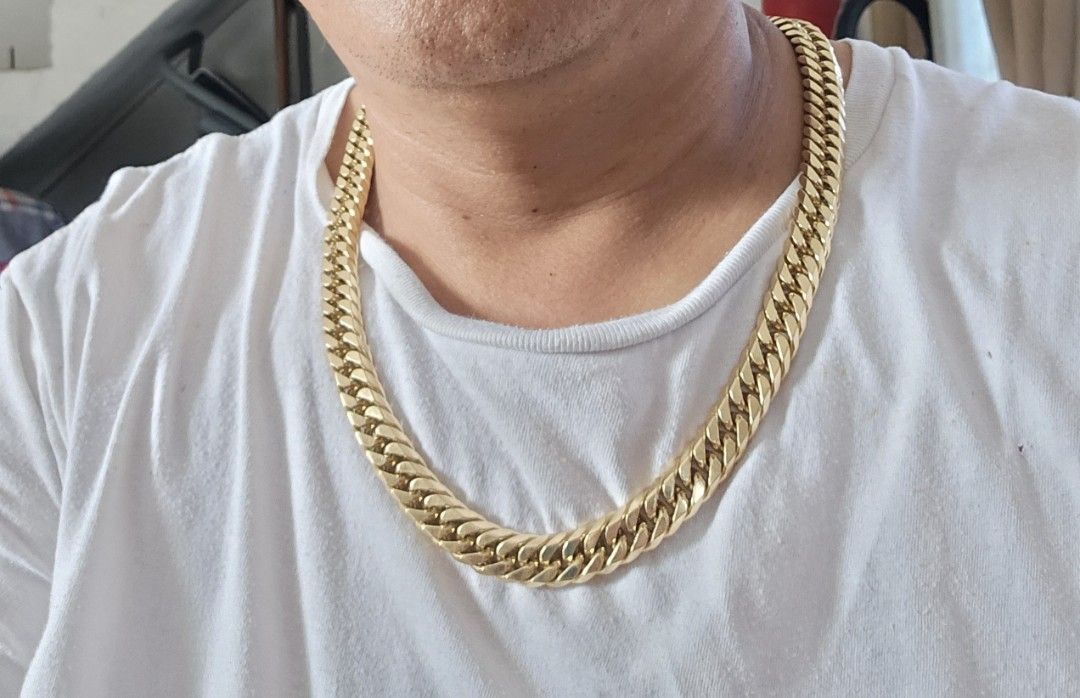 18K Gold Cuban Link Necklace (Category: Necklaces) located in Tagbilaran City. Submitted by lugarpogi (Listing ID 1410424348, Image 1). Description: - 18K Gold Cuban Link Necklace - Classic curb chain design - Secure clasp - Marked "K18" - Bright gold color - Substantial and luxurious piece Japan Gold 18k 299.8 grams 7850 pesos per / gram..