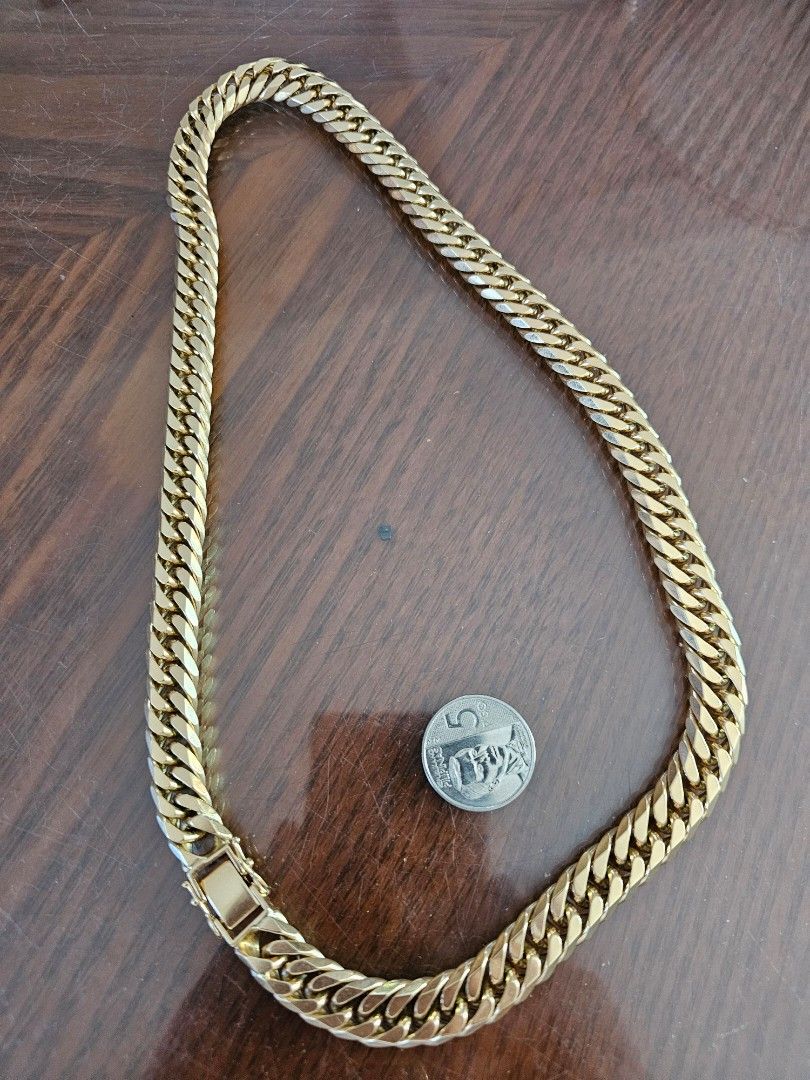 18K Gold Cuban Link Necklace (Category: Necklaces) located in Tagbilaran City. Submitted by lugarpogi (Listing ID 1410424348, Image 2). Description: - 18K Gold Cuban Link Necklace - Classic curb chain design - Secure clasp - Marked "K18" - Bright gold color - Substantial and luxurious piece Japan Gold 18k 299.8 grams 7850 pesos per / gram..