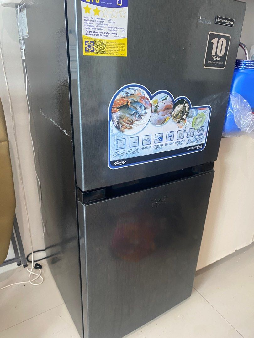 American Home 2 Door (Category: Refrigerators and Freezers) located in Las Pinas. Submitted by trisdanchase (Listing ID 1410425803, Image 1). Description: American Home Ref 2 Door Inverter For Sale Php 9999 from Php 15999 Minor damage on chiller door RFS: Moving out no space in new area - Whirlpool two-door refrigerator - Top freezer and bottom refrigerator design - Dark gray finish - Multiple shelves for organized storage - 10-year warranty.