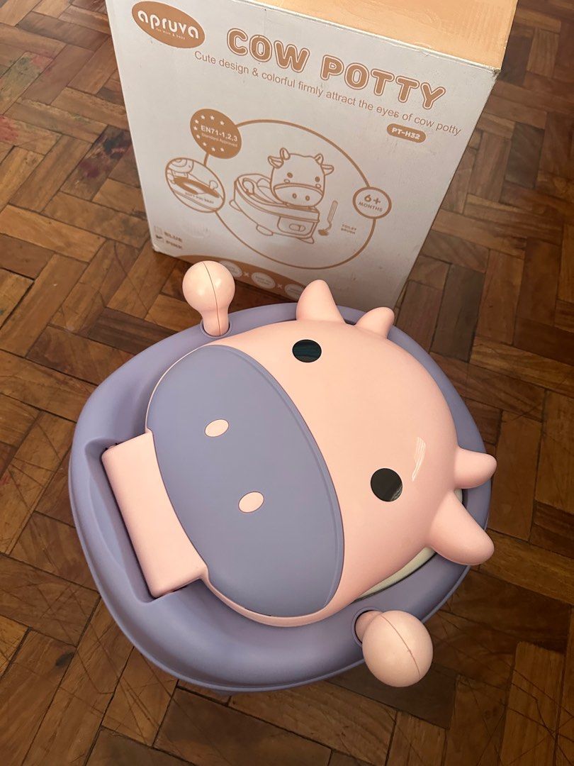 Apruva Cow Potty Trainer (Category: Toilet Training) located in Naga. Submitted by shifttothrift.joy (Listing ID 1410416852, Image 1). Description: Apruva Potty Trainer Purple-Pink Cow Design Brand new; just opened but unused Complete with box and accessories Reason for Selling: we opted to use toilet seat for our kid’s potty training Pick up from 📍Fluff & Fold Laundry Shop 68 MT Villanueva Ave. Liboton Naga City Camarines Sur (beside Aquabest).